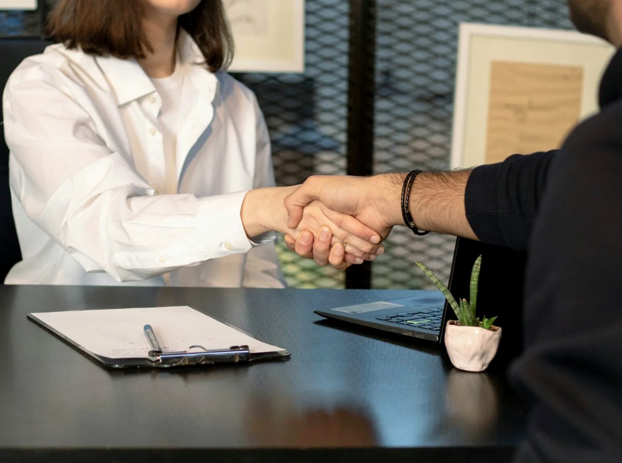 A successful handshake after landing an offer